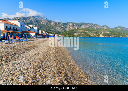 View of Kokkari beach and town houses in distance, Samos island, Greece Stock Photo