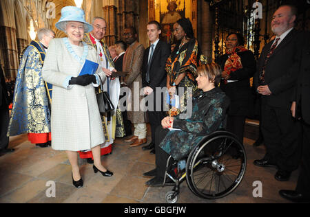 Britain's Queen Elizabeth II meets Dame Tanni Grey-Thompson (centre right) following today's Commonwealth Observance Service at Westminster Abbey. Stock Photo