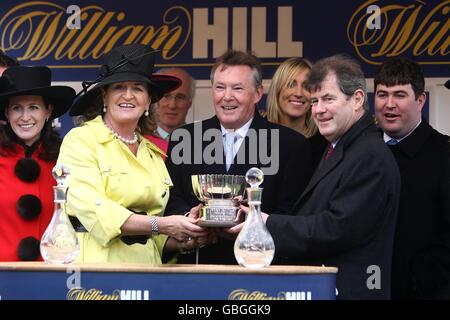 Owner John P McManus (2nd right) after winning the William Hill Trophy Handicap Chase with Wichita Lineman. Stock Photo