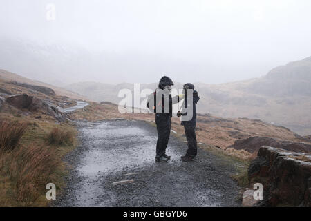 Snowdon miners path in wet weather Stock Photo