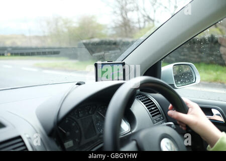 Sat nav driving in the rain Stock Photo