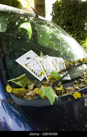 Multiple parking tickets on car windscreen Stock Photo