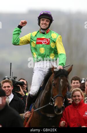 Ruby Walsh celebrates after winning the Stan James Champion Hurdle ...