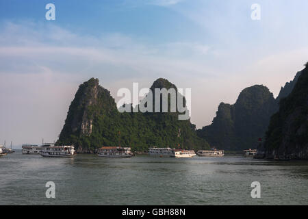 Tourist boats swarm around the harbour, Dao Go Island, Ha Long Bay, Quang Ninh Province, Viet Nam Stock Photo