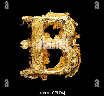 Alphabet and numbers in rough gold leaf isolated on black Stock Photo