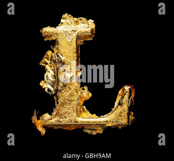 Alphabet and numbers in rough gold leaf isolated on black Stock Photo