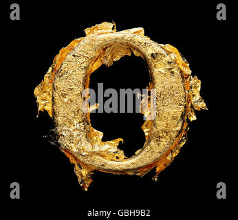 Alphabet and numbers in rough gold leaf isolated on black Stock Photo