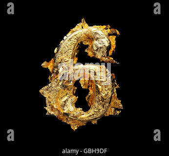 Alphabet and numbers in rough gold leaf isolated on black Stock Photo