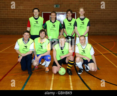 The Lionhearts (back row left to right) Jon Arnold, Steve Cowie, Rob Dimsdale, Graham Booth, (front row, left to right) Paul Neal, Louis Davy, Lee Richards and Ian Hall before they successfully set a new Five-A-Side football World record at 25 hours exactly to raise money for the Children's Heart Surgery Fund at Leeds General Infirmary where Zoe received treatment. The record was set at the Leeds University Sport Hall, Leeds. Stock Photo