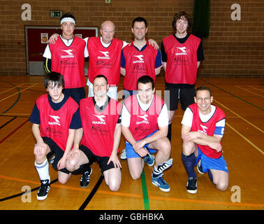 The Bravehearts, (back row, left to right) Joe Presto, Phil Hardy, Stuart Banyard, Paul Whittle, (front row, left to right) John Hardy, Gregor Donaldson, Benj Frost and Sam Merce before they successfully set a new Five-A-Side football World record at 25 hours exactly to raise money for the Children's Heart Surgery Fund at Leeds General Infirmary where Zoe received treatment. The record was set at the Leeds University Sport Hall, Leeds. Stock Photo