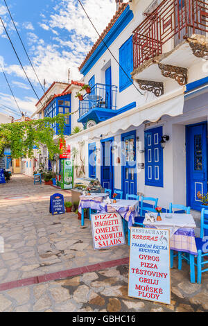 SAMOS ISLAND, GREECE - SEP 24, 2015: blue and white color traditional Greek tavern in Kokkari town on coast of Samos island, Gre Stock Photo