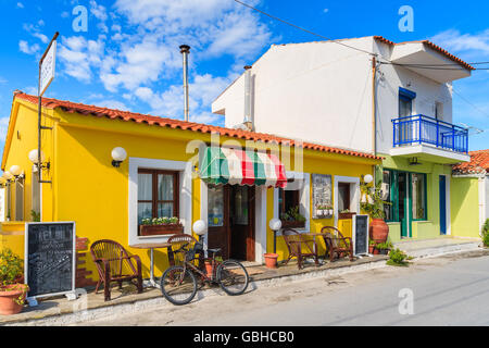 SAMOS ISLAND, GREECE - SEP 24, 2015: colourful building of Italian restaurant on street of Kokkari town, Samos island, Greece. Stock Photo