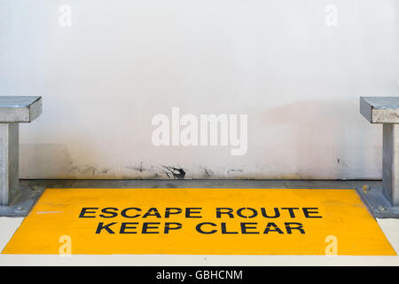 Escape route, keep clear sign blocked by concrete wall with copy space, clipping path for travel image adaptation Stock Photo