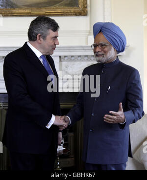 Indian Prime Minister Manmohan Singh is welcomed by British Prime Minister Gordon Brown at 10 Downing Street in London, ahead of the London G20 world leaders meeting. Stock Photo
