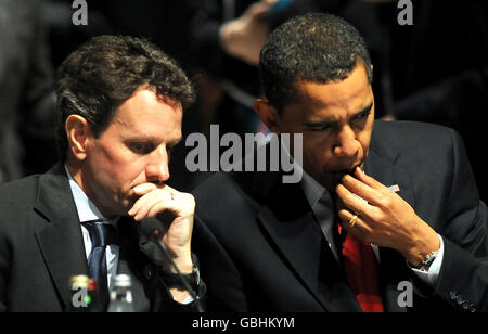Timothy Geithner, Secretary of the Treasury of the United States (left) and US President Barack Obama look-on during the Plenary Session at the G20 Summit at the Excel Centre in East London. Stock Photo