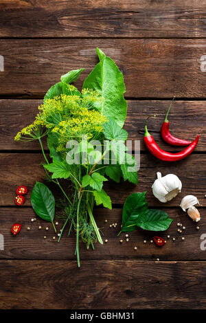 pickling cucumbers ingredients, herbs, spices, top view, rustic style Stock Photo