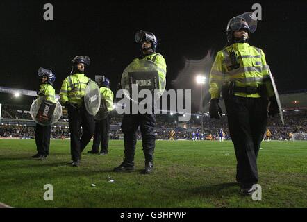 Soccer - Coca-Cola Championship - Birmingham City v Wolverhampton Wanderers - St Andrew's Stadium. Police in riot gear stand on the pitch after the final whistle. Stock Photo