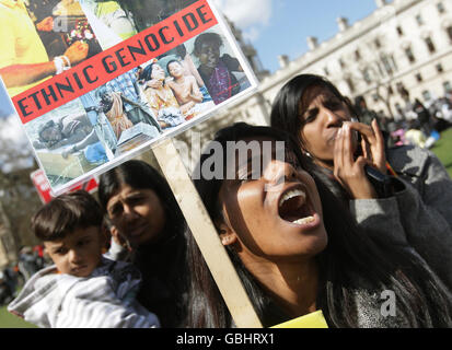 Demonstrators take part in a protest to call for an immediate ceasefire in Sri Lanka, at Parliament Square, Westminster, London. Stock Photo