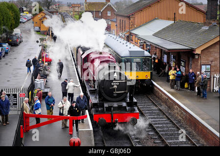 Railway enthusiasts gather to take pictures and gaze at the recently restored LMS 6100 Royal Scot steam engine at Bishop's Lydeard train station on its first day of four days taking part in the West Somerset Railway's Spring steam gala. Stock Photo