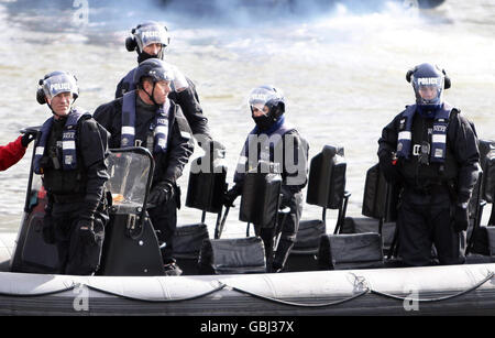 Rowing - The Boat Race 2009 - River Thames. police look on at the finish of the 2009 Boat Race on the River Thames, London. Stock Photo