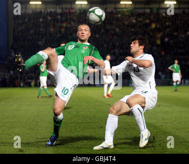 Northern Ireland's Warren Feeney battles with Slovenia's Bojan Jokic during the World Cup Qualifying match at Windsor Park, Belfast. Stock Photo