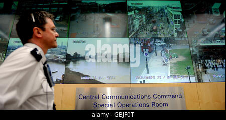 Chief Inspector Sam Simpson views live footage from CCTV cameras shown on a large screen in the Metropolitan Police Specialist Operations Room in Lambeth, south London. Police will have access to more than 3,000 CCTV cameras as the world's most powerful political leaders arrive in London for Thursday's G20 summit. Senior officers were continuing their preparations today at Scotland Yard's Central Communications Command. Stock Photo