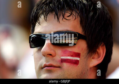 Soccer - UEFA European Championship 2004 - Group D - Czech Republic v Latvia. The reflection of Aviero Municipal, venue for the European Championships 2004 in a Latvian fans glasses Stock Photo