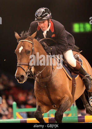 Great Britain's Guy Williams in action on 'Torinto van de Middelstede' during the British Open Show Jumping Championships at the LG Arena, Birmingham. Stock Photo