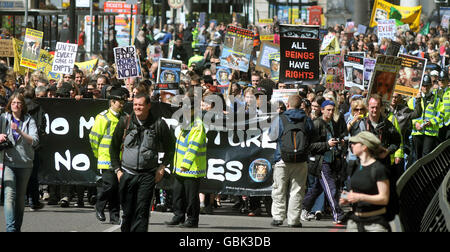 A demonstration for the World Day for Animals in Laboratories March, makes it way through the streets of London. Stock Photo