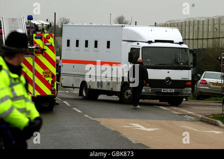 Prison vans outside HMP Ashwell near Oakham, Rutland, Leicestershire as specialist officers deal with a disturbance inside the prison. Stock Photo