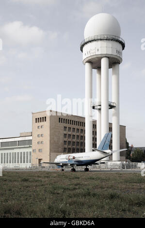 Radar tower and an old aircraft on the grounds of the former Tempelhof Airport, Berlin Stock Photo