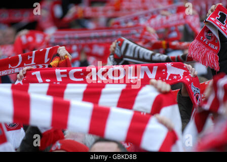 Cologne fans holding up their scarves, Bundesliga federal league, 1. FC Koeln - FSV Mainz 05 4:2, Rhein-Energie-Stadion, Cologne Stock Photo