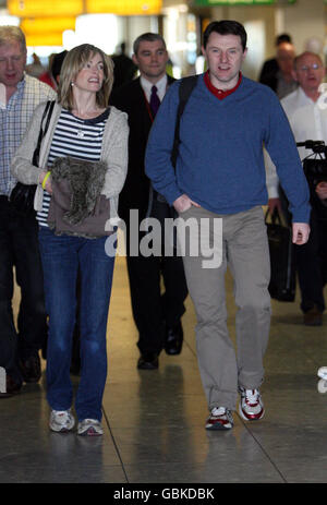 Kate and Gerry McCann prepare to fly out of Heathrow Airport, Middlesex, to the United States to film an interview for the Oprah Winfrey Show to mark two years since their daughter Madeleine's disappearance. Stock Photo