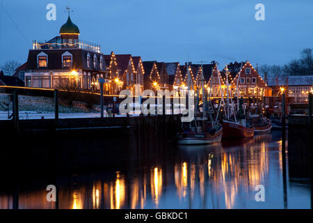 Illuminated harbour area, North Sea resort of Neuharlingersiel, North Sea, East Frisia, Lower Saxony Stock Photo