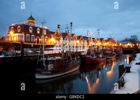 Illuminated harbour area, North Sea resort of Neuharlingersiel, North Sea, East Frisia, Lower Saxony Stock Photo