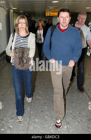 Kate and Gerry McCann prepare to fly out of Heathrow Airport, Middlesex, to the United States to film an interview for the Oprah Winfrey Show to mark two years since their daughter Madeleine's disappearance. Stock Photo