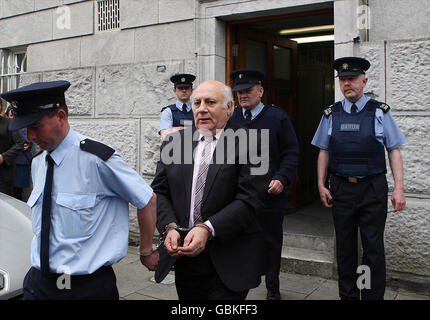 Ted Cunningham who laundered cash from the Northern Bank robbery being led away after receiving a ten years jail sentence. Stock Photo