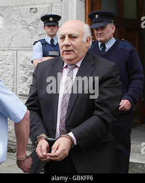 Ted Cunningham who laundered cash from the Northern Bank robbery being led away after receiving a ten years jail sentence. Stock Photo