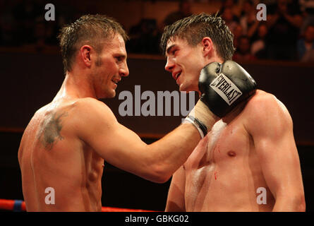 Jamie Cox (right) with opponent Mark Lloyd after his victory in the final round of eight stoppage in the Eliminator for the British Welterweight Title at the Civic Hall, Wolverhampton. Stock Photo