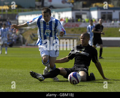 Brighton and Hove Albion's Dean Cox is is tackled in the penalty box by Stockport County's Josh Thompson during the Coca-Cola League One match at the Withdean Stadium, Brighton. Stock Photo