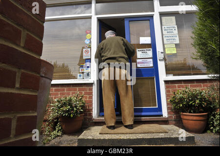 An unidentified man enters Hamilton Hall Hotel, Bournemouth, where controversial euthanasia activist Dr Philip Nitschke, dubbed Dr Death, gives a suicide workshop presentation. Stock Photo