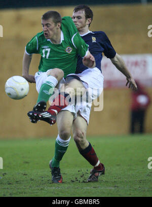 Scotland's Mark Reynolds and Northern Ireland's James Lawrie battle for the ball during the Tennents B International Challenge match at Broadwood Stadium, Cumbernauld. Stock Photo