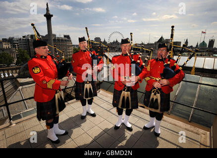 Members of the Royal Canadian Mounted Police bands, they are each from different police bands, on the roof of Canada House, London ahead of their performance at the Windsor Castle Royal Tattoo between May 13th to 17th, at which they will also present the Queen with a new horse named George. Stock Photo