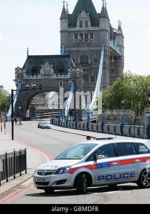 Police keep the road on London's Tower Bridge closed after an elevator accident in the north tower of the structure, which left six people injured. Stock Photo
