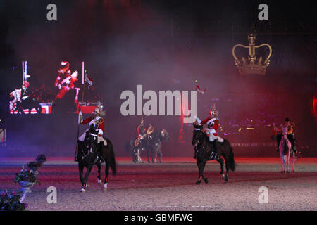 The Household Cavalry Musical Ride perform at the Windsor Castle Royal Tattoo in Berkshire. Stock Photo