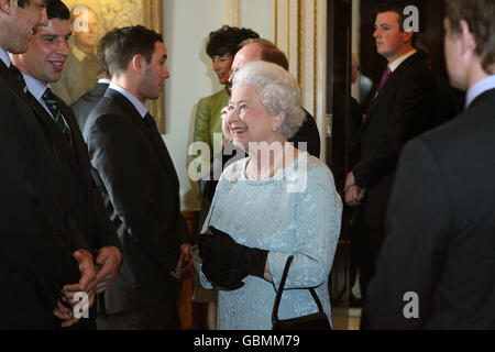 Queen Elizabeth II meets members of the RBS 6 Nations Grand Slam winning Irish rugby team at Hillsborough Castle on the second day of her visit to Northern Ireland. Stock Photo