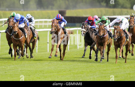San Sicharia and Pat Smullen (white, right cap) go on to win The totesportbingo.com Chartwell Fillies' Stakes at Lingfield Park Racecourse. Stock Photo