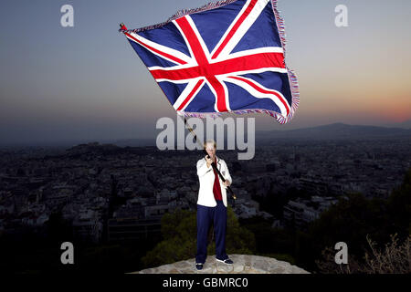 Athens Olympic Games 2004 - British Olympic Association Press Conference. Great Britain's Judo competitor, Kate Howey, holds the Union Jack flag aloft Stock Photo