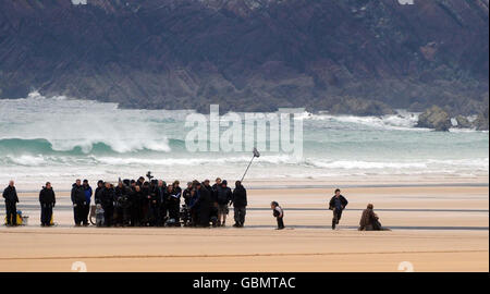 Daniel Radcliffe who plays Harry Potter, second right, during filming on the beach at Freshwater West in Pembrokeshire, of the seventh and final Harry Potter film (Harry Potter and the Deathly Hallows) starring Daniel Radcliffe. Stock Photo