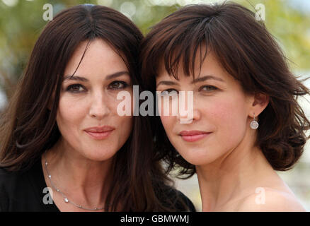 Actresses Monica Bellucci (left) and Sophie Marceau attend a photocall for their film 'Don't Look Back' at the Palais des Festivals, in Cannes, France, at the 62nd annual Cannes Film Festival. Stock Photo